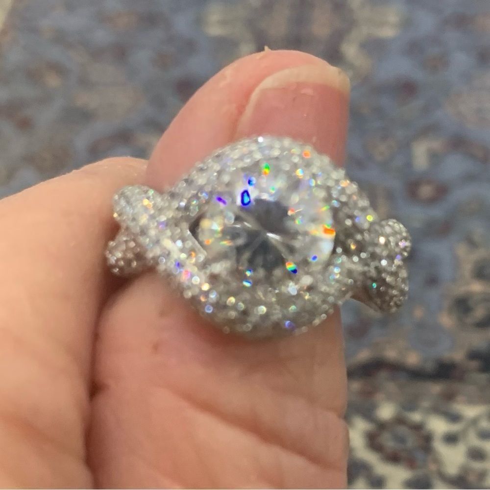 Unique and lovely solitaire style with a wrap effect size 8. CZ and silver